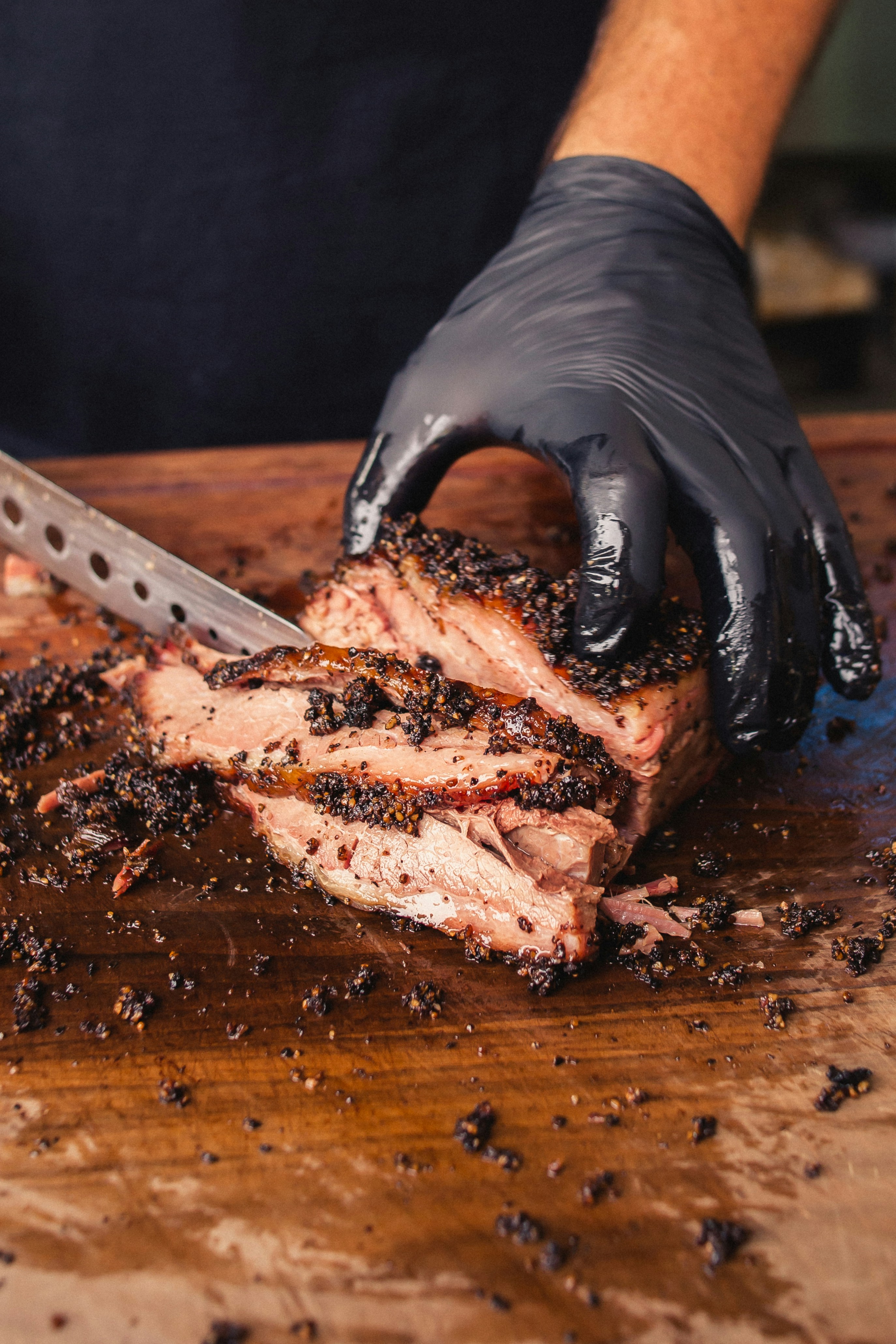 Close-up of brisket being sliced by hand